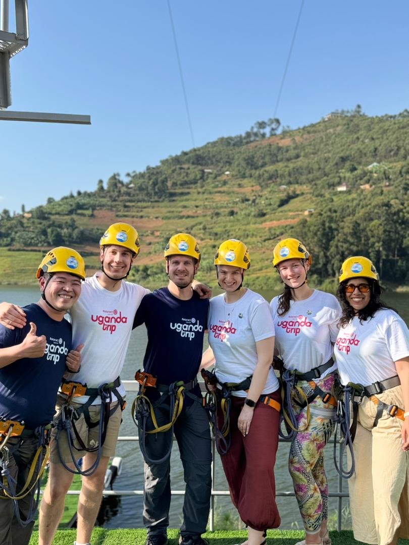 Tourists getting ready with safety gear for the zipline experience at Bunyonyi Luxury Resort.